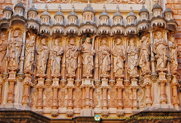 Montserrat Basilica facade with sculptures of Christ and the apostles