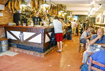 San Sebastian Restaurant: Legs of Jabugo ham hanging inside La Cepa