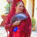 Dressed in the traditional mantilla and Spanish fan