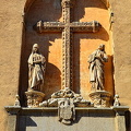 The cross is richly carved with plant motifs