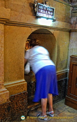 A faithful kissing the Holy Pilar