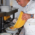 Chef preparing raclette