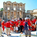 A bright tour group visiting Ephesus Library