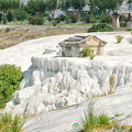 A sarcophagus submerged in travertine