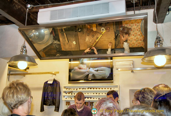 A leather demonstration viewed from the overhead mirror