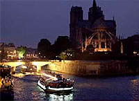 A tourist sightseeing barge outside Notre Dame Cathedral